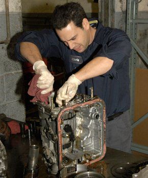 Mechanic repairing the car transmission