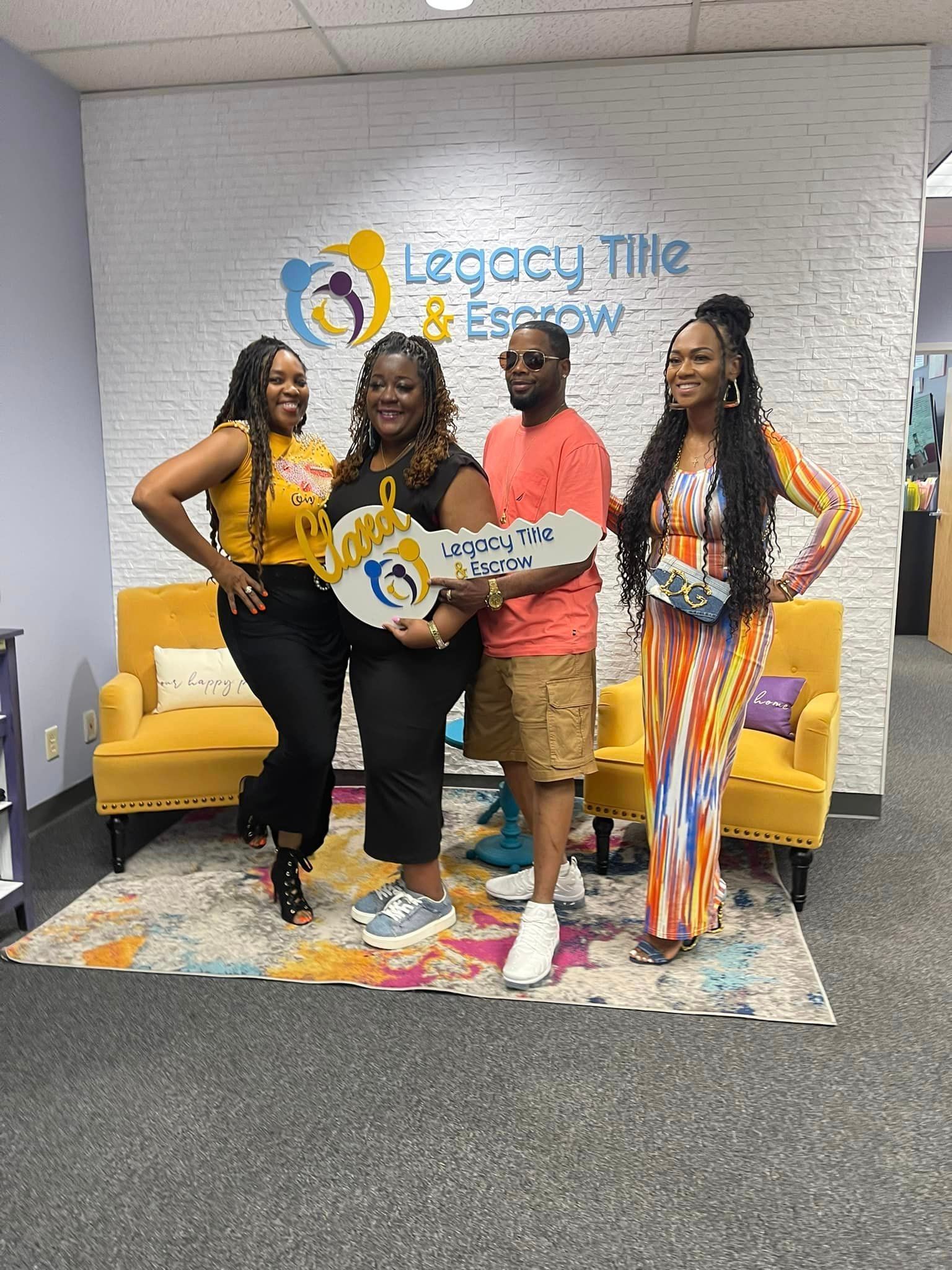 A group of people are standing next to each other in a room holding keys.