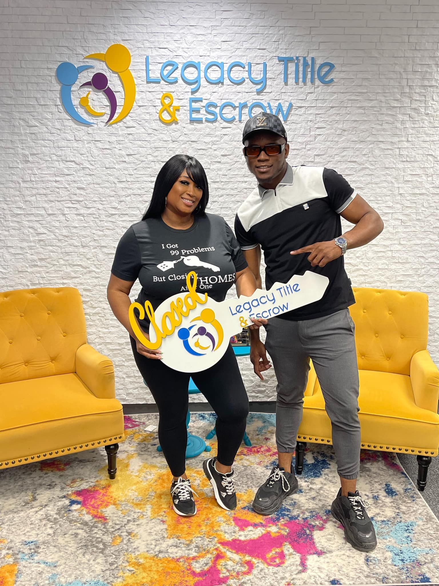 A man and a woman are standing next to each other holding keys.