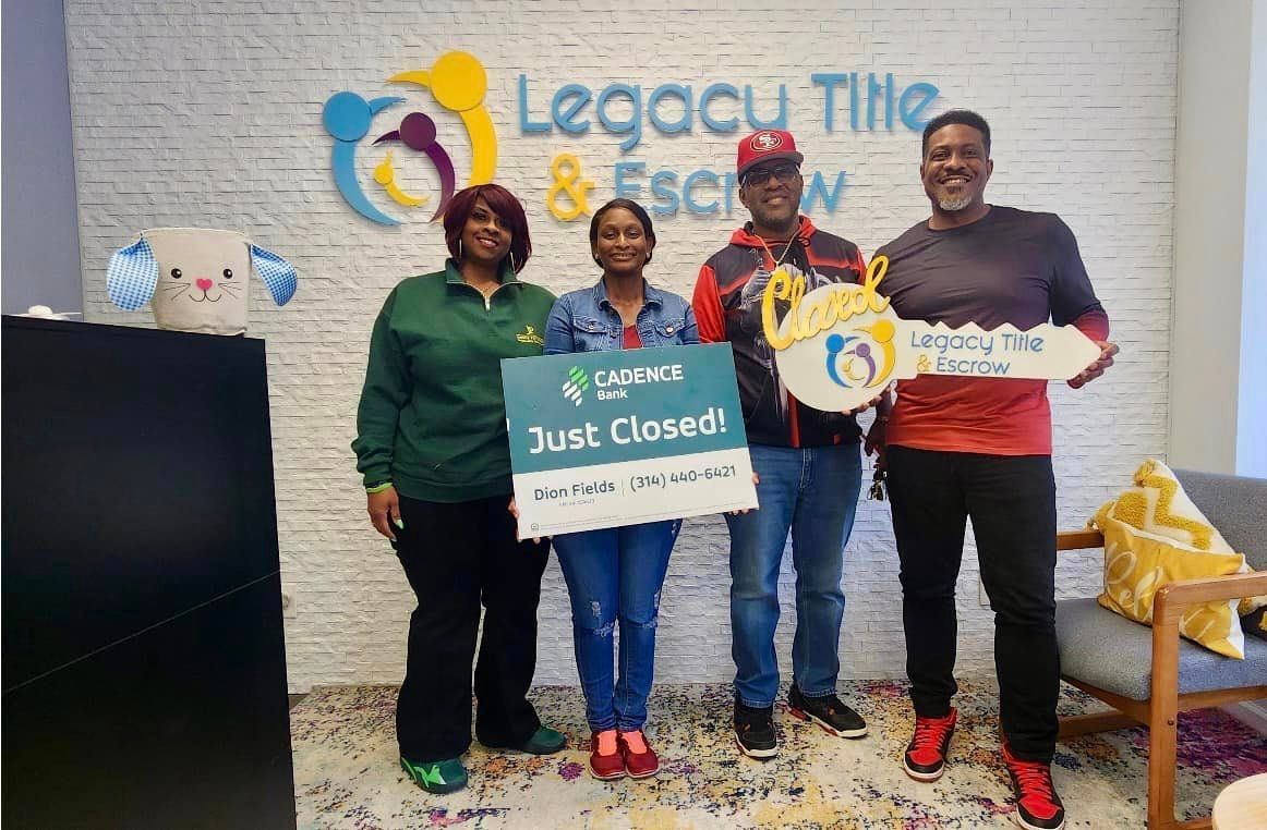 A group of people standing next to each other holding keys.