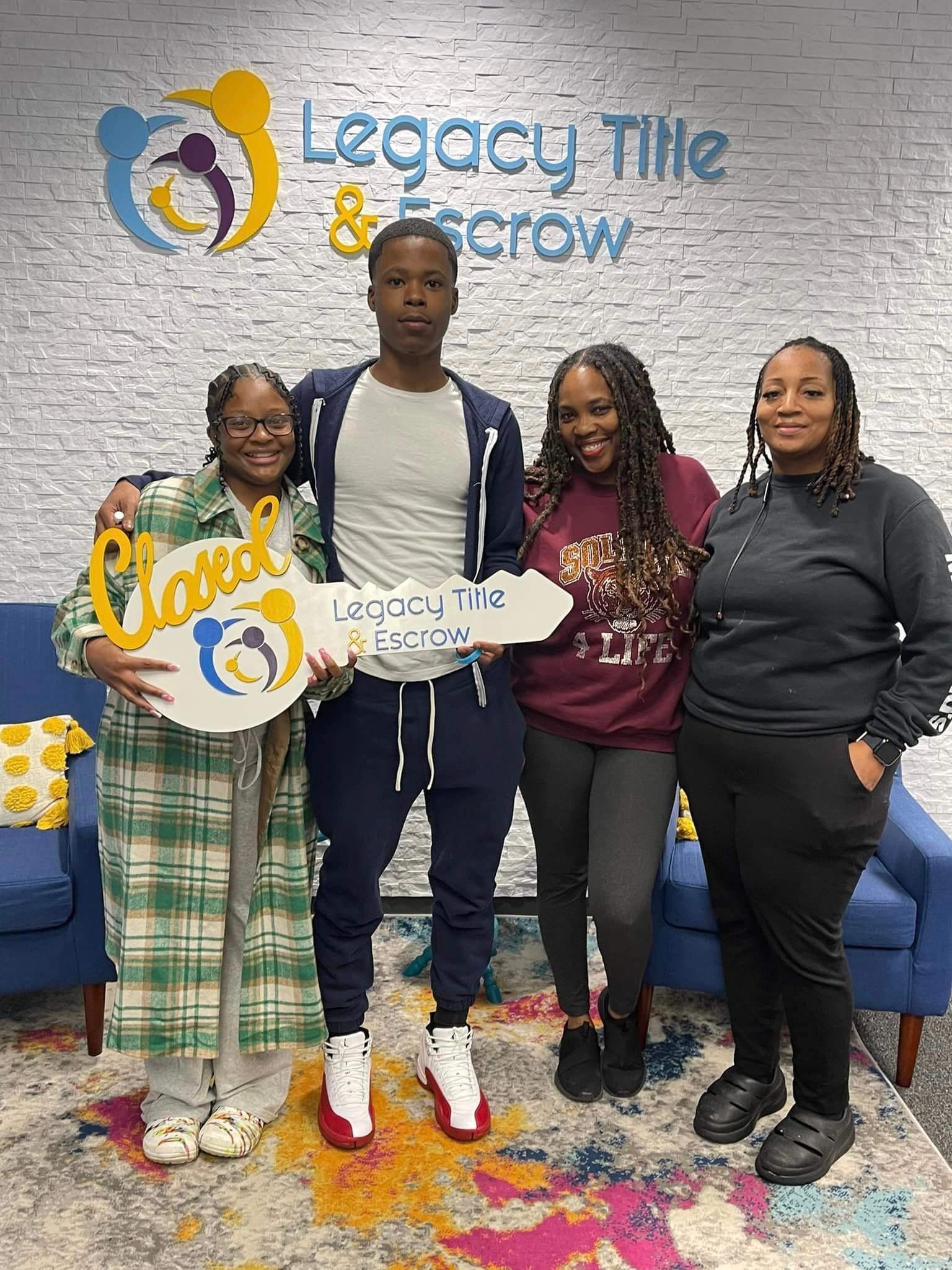 A group of people standing next to each other holding keys.