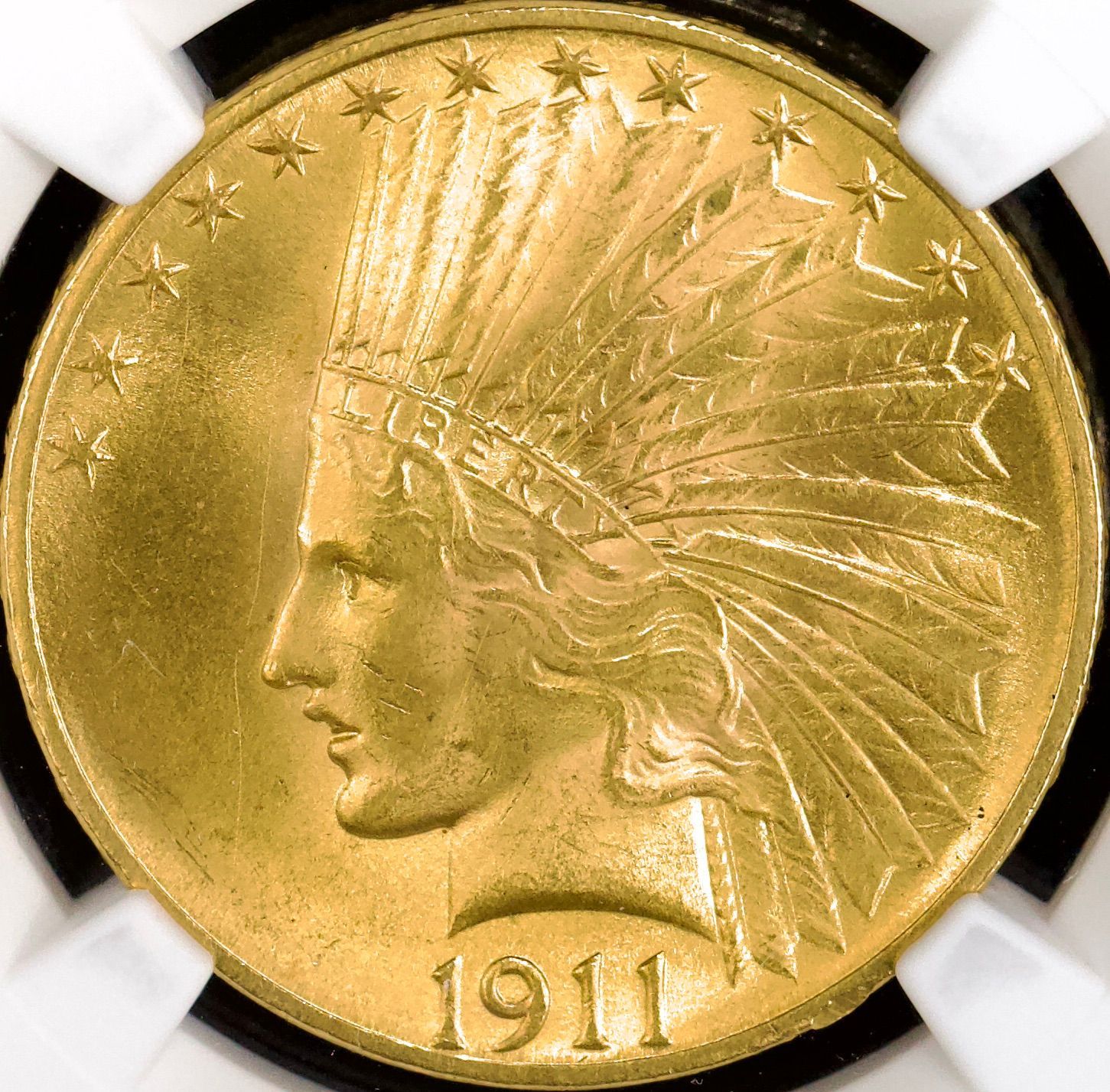 A gold coin with the year 1911 on it