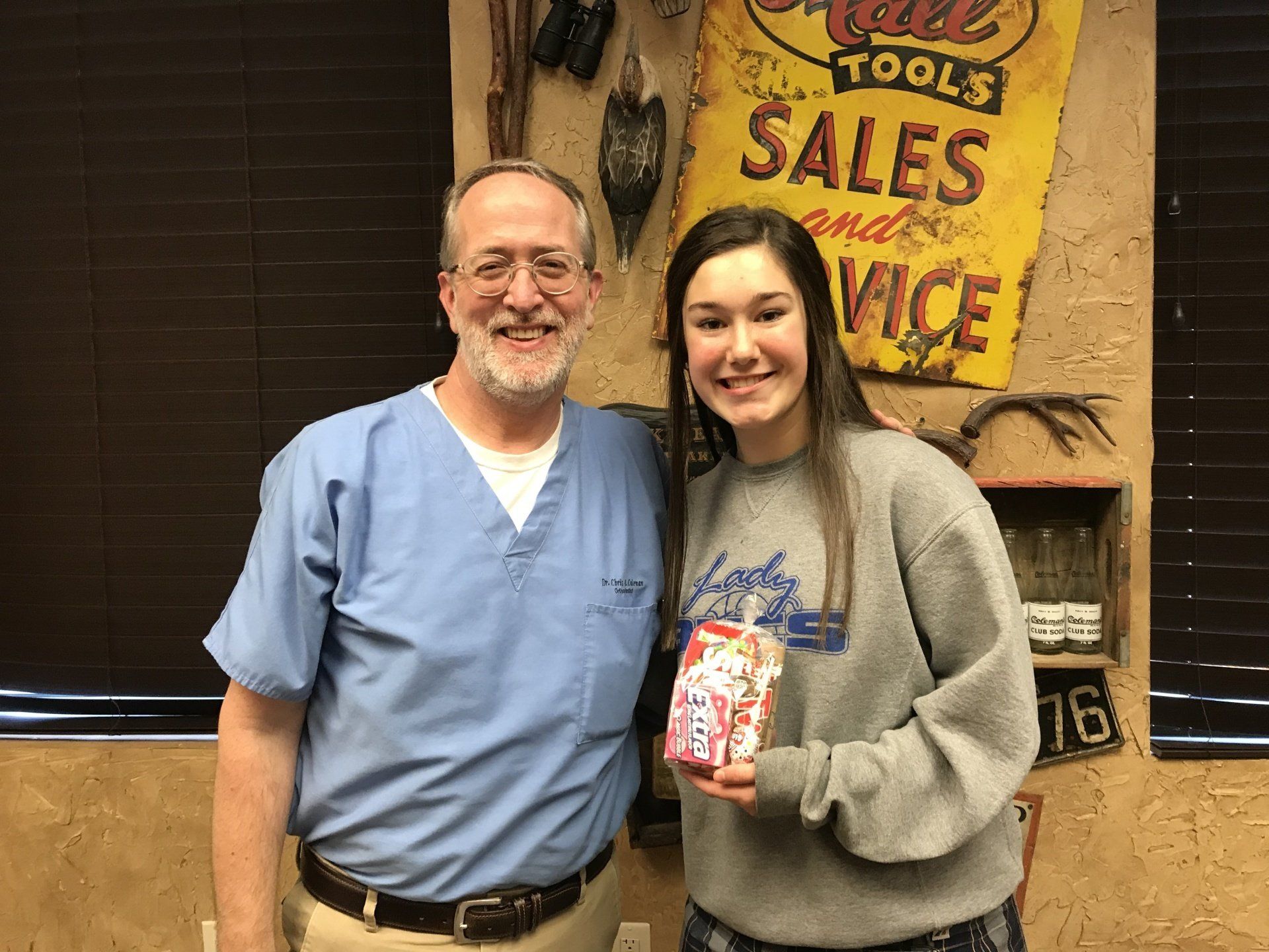 Dr. Coleman and patient after braces