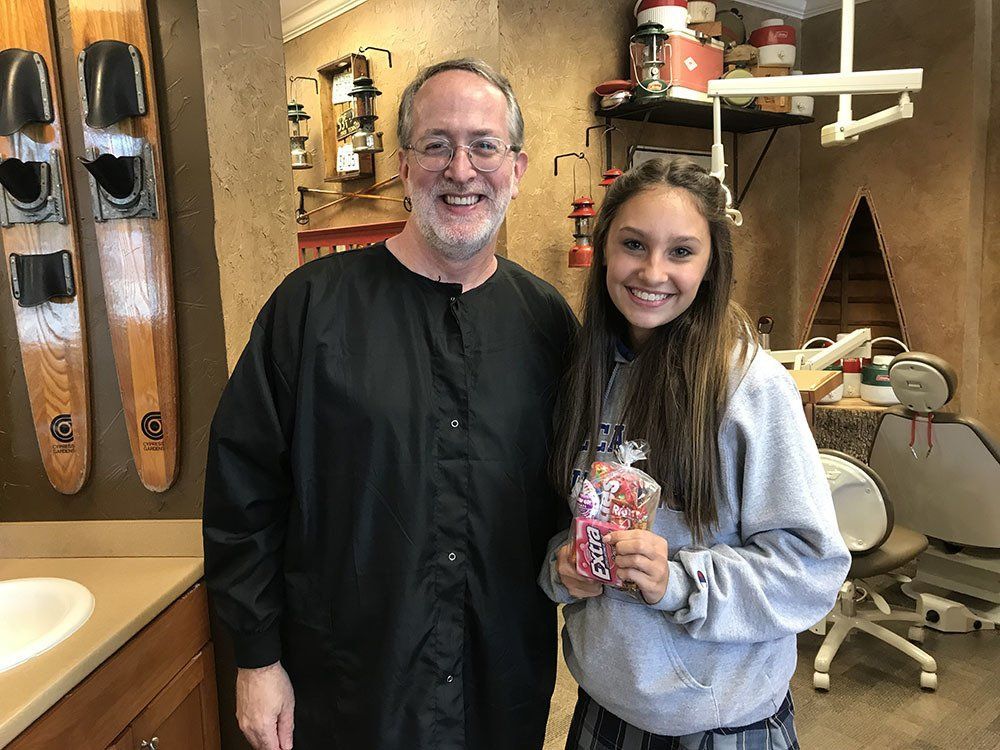 Dr. Coleman and patient after braces