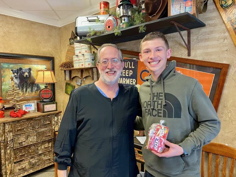 Dr. Coleman and patient after braces