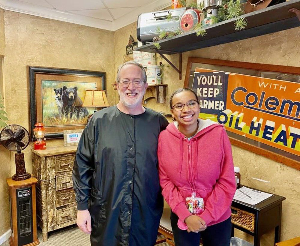 Dr. Coleman and patient before braces