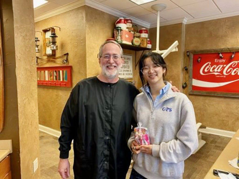 Dr. Coleman and patient before braces
