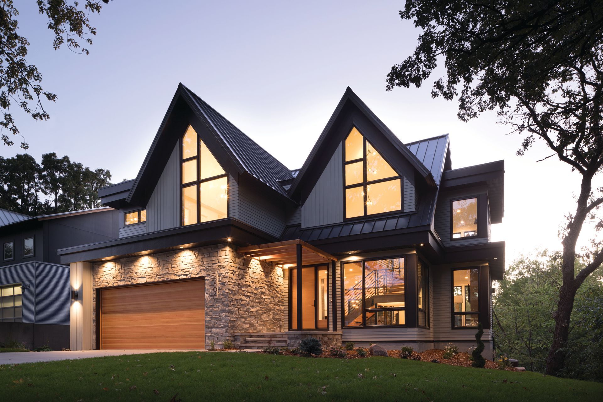 A large house with a lot of windows and a garage