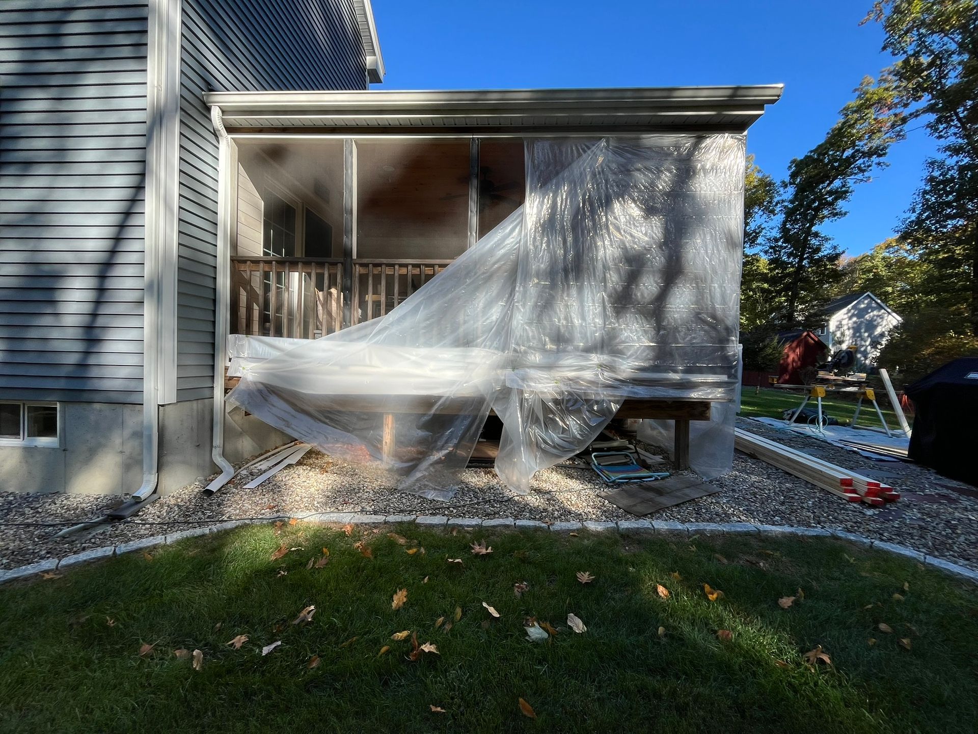 A house with a porch that is being remodeled