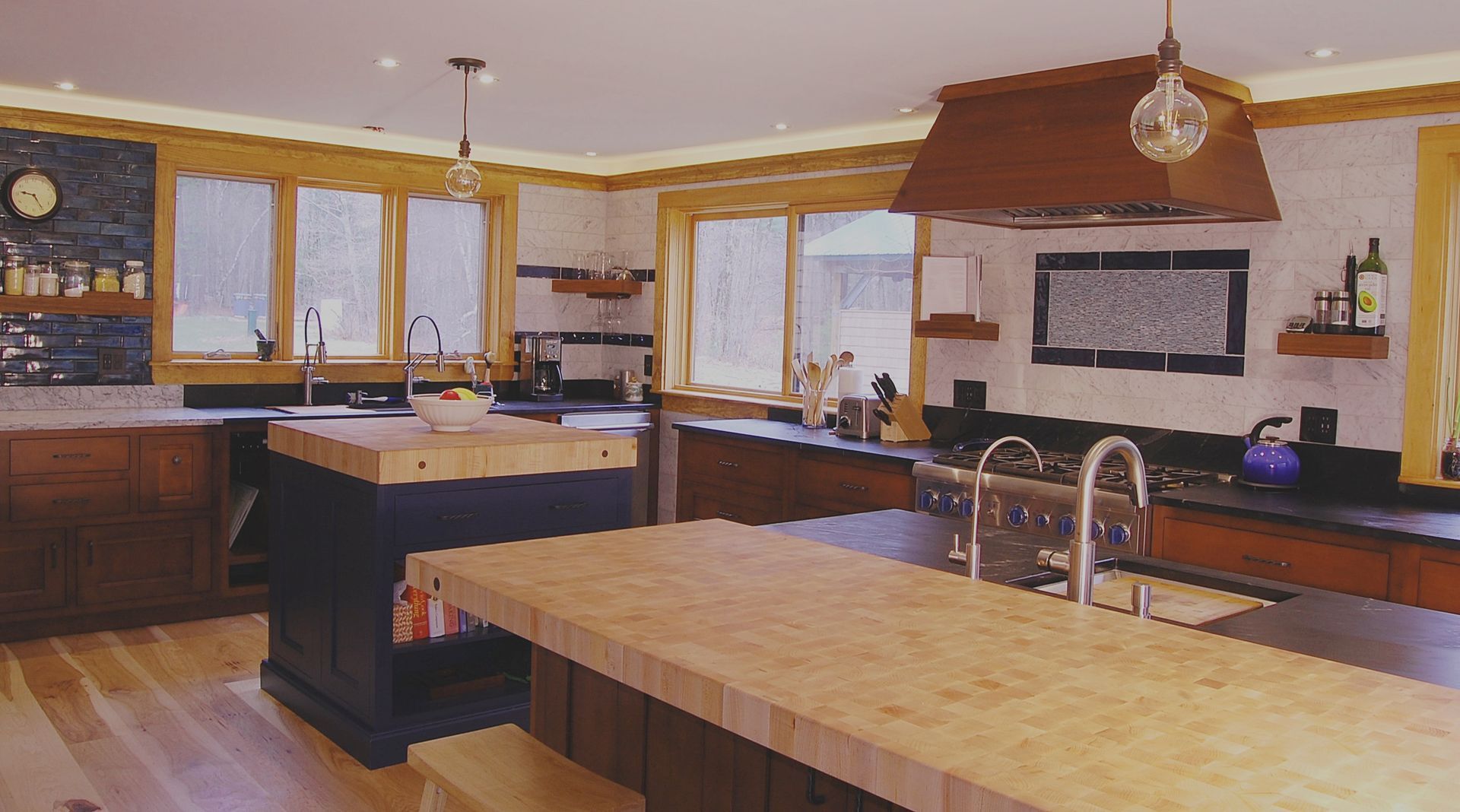 A kitchen with a large island in the middle of it