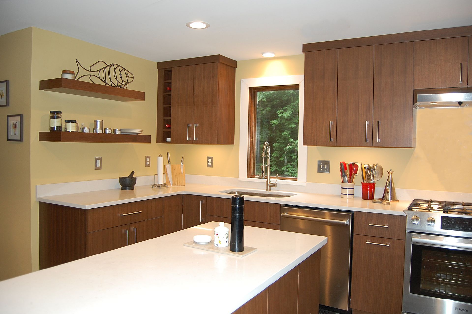 A kitchen with stainless steel appliances and wooden cabinets