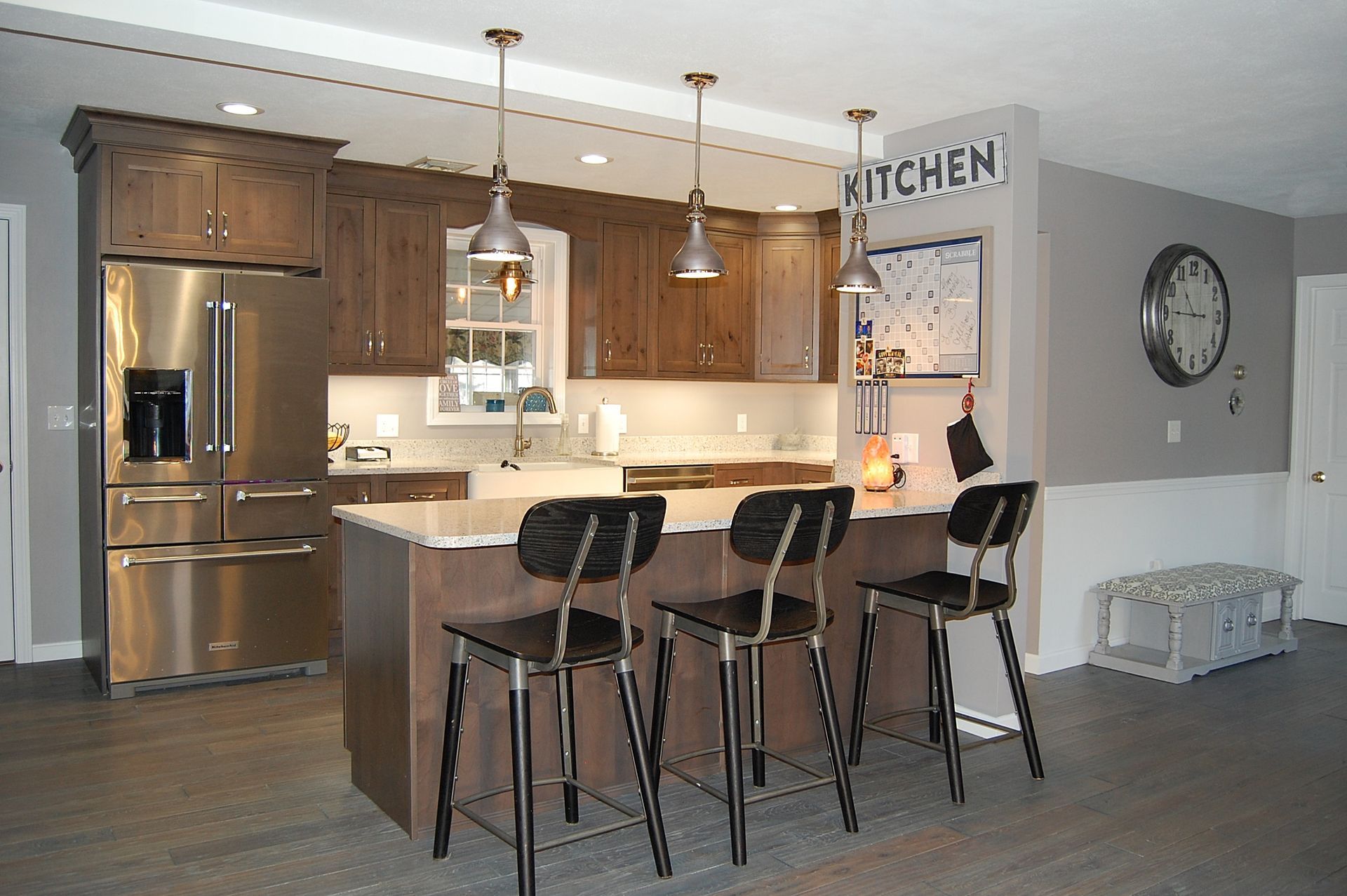 A kitchen with a sign that says kitchen on the wall