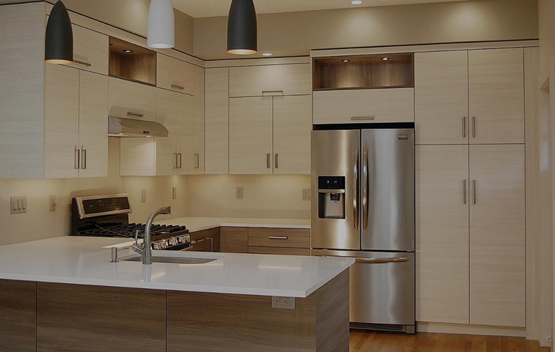 A kitchen with stainless steel appliances and white cabinets