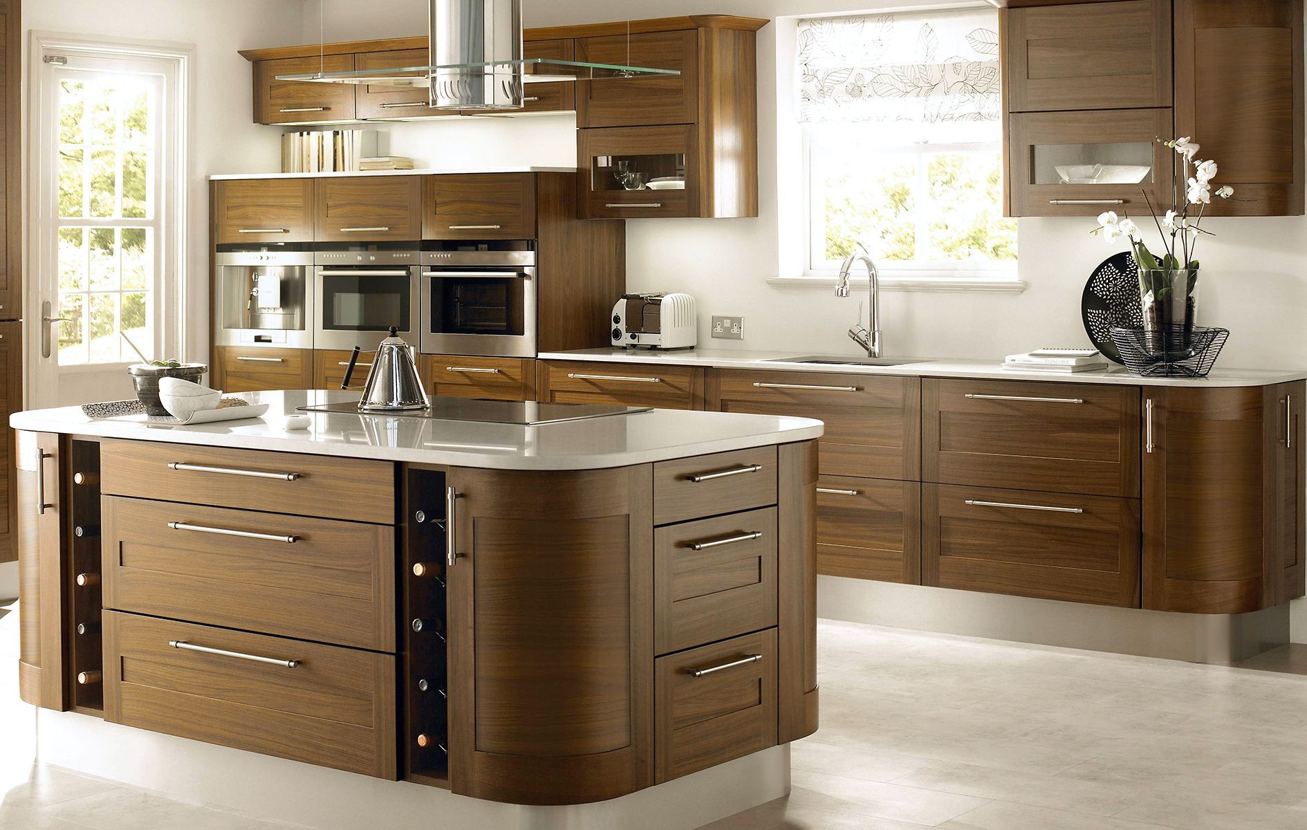 A kitchen with wooden cabinets and stainless steel appliances
