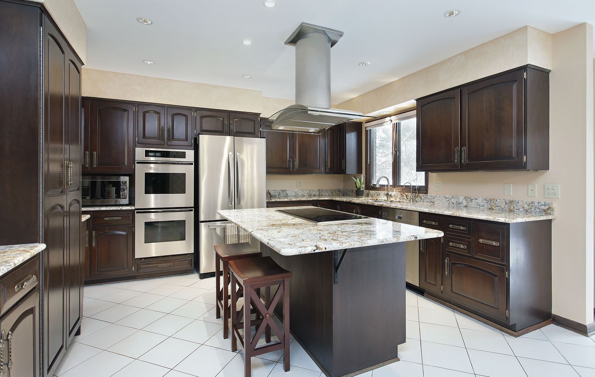 A kitchen with stainless steel appliances and granite counter tops