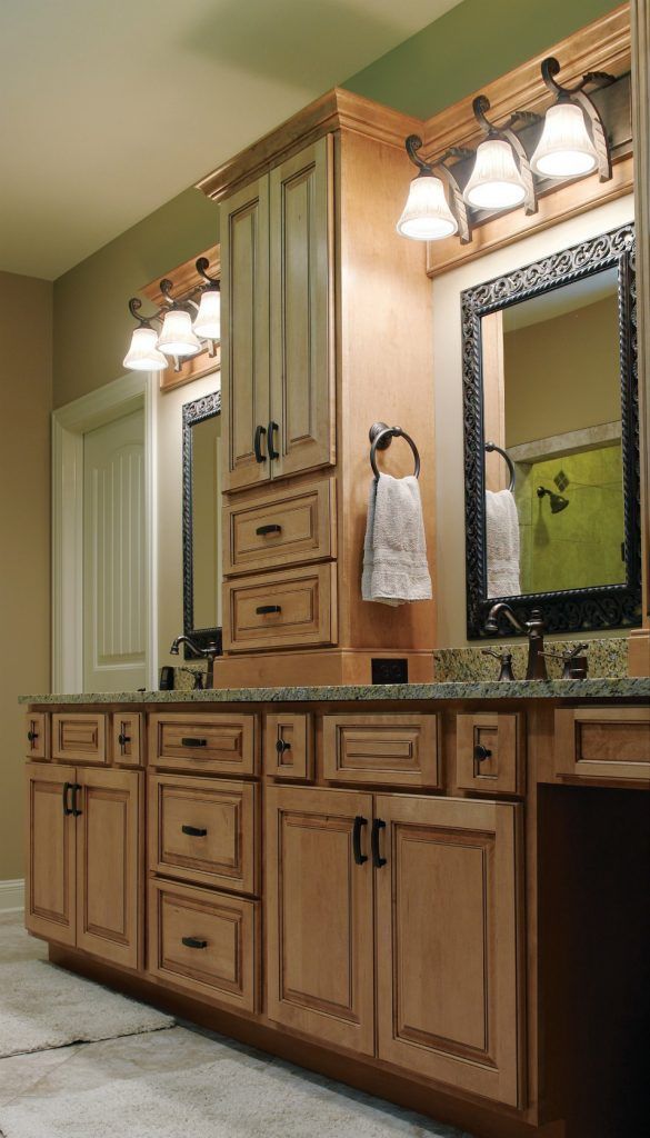 A bathroom with two sinks and two mirrors.