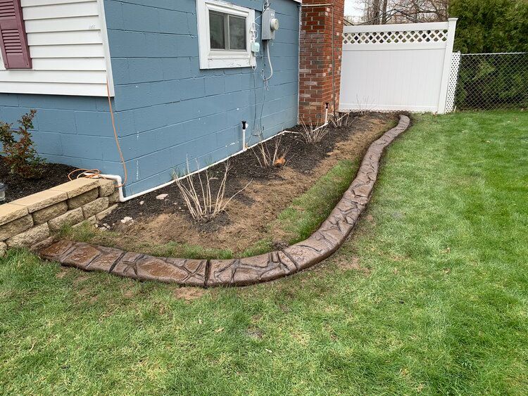 a sidewalk is being installed in front of a house