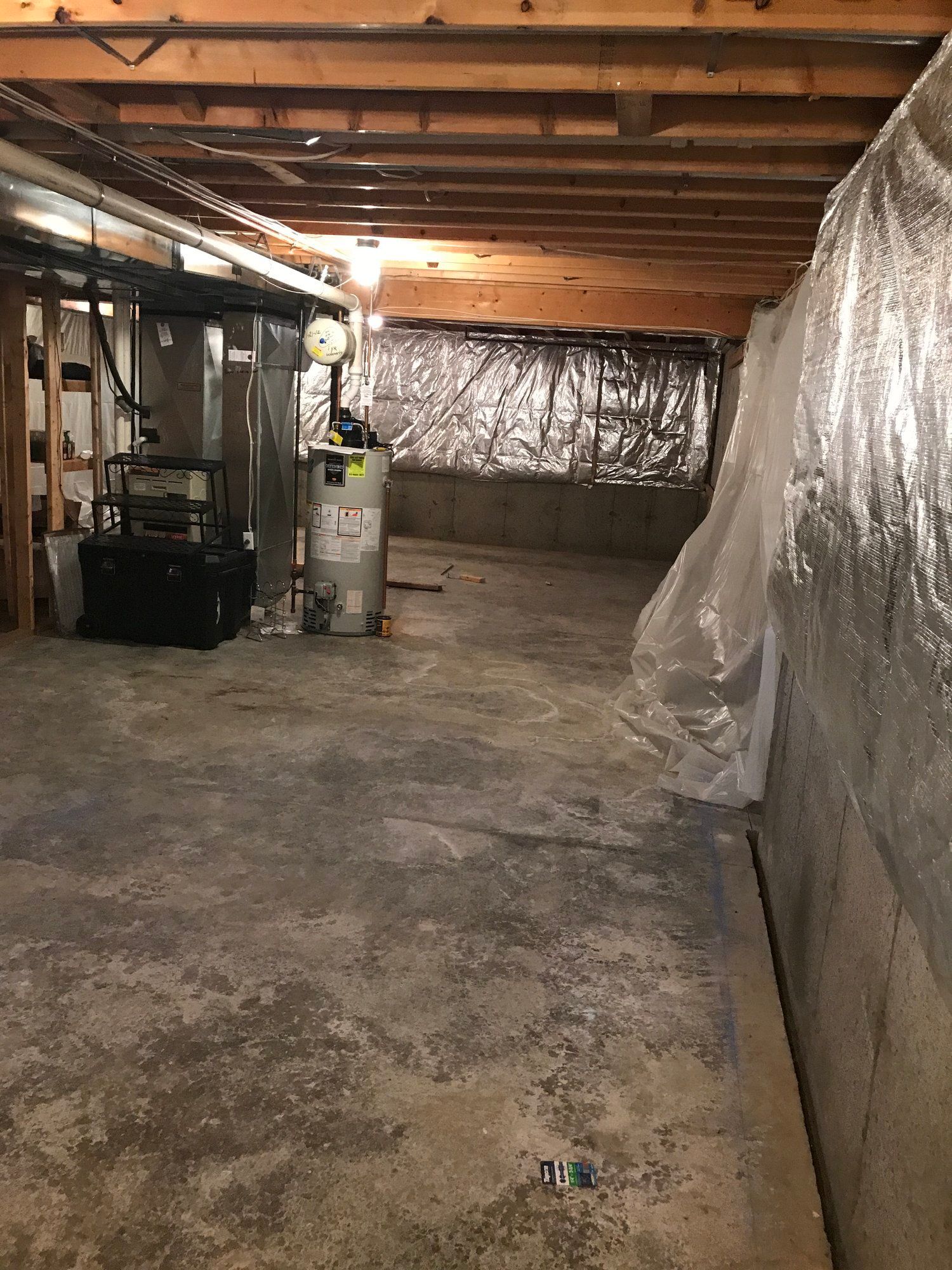a basement with a furnace and a heater in it