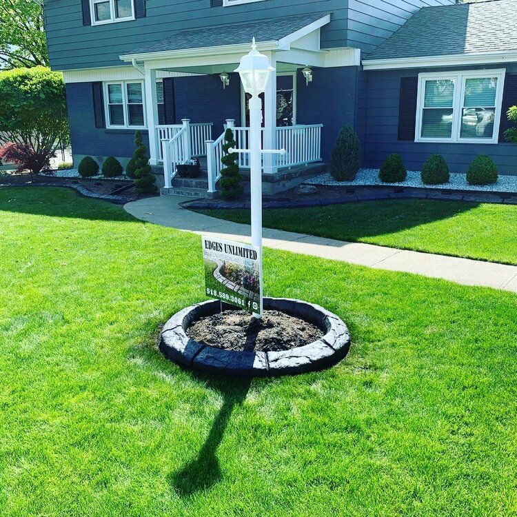 a house with a for sale sign in front of it