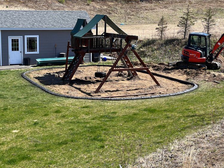 a playground set is being built in a backyard next to a house