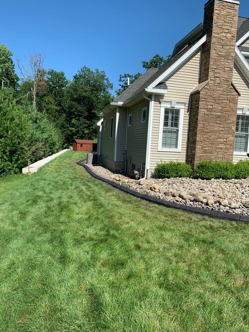 a house with a large lawn in front of it