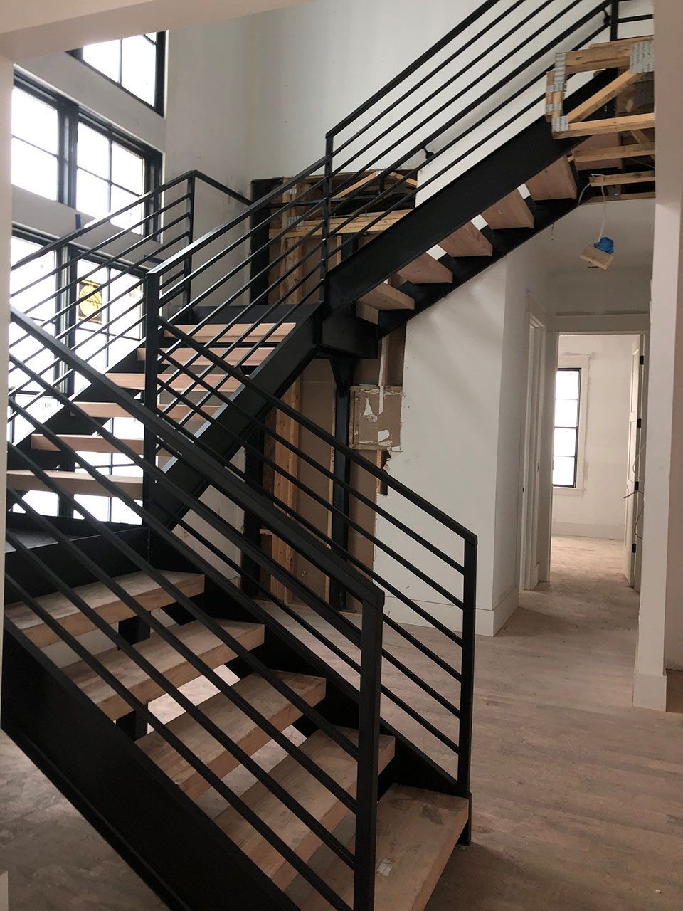 There is a ramp leading to the front door of a brick house.