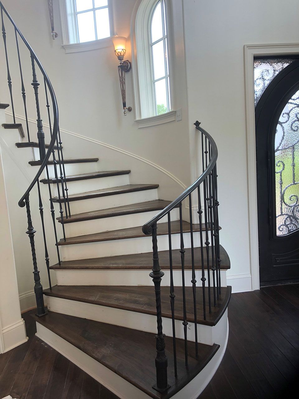 A black mailbox on the side of a road