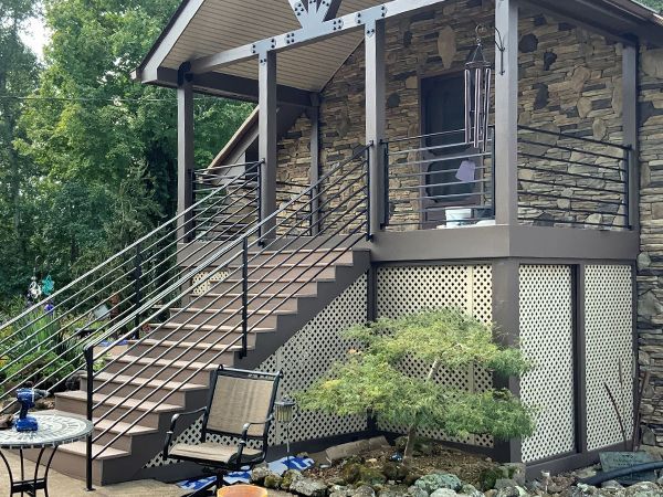A stone house with stairs leading up to it