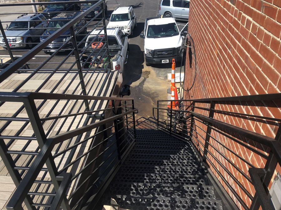 A set of stairs leading up to a brick building