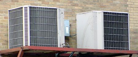 2 air conditioners attached to a building