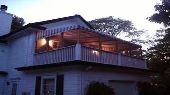 House with lit balcony at dusk