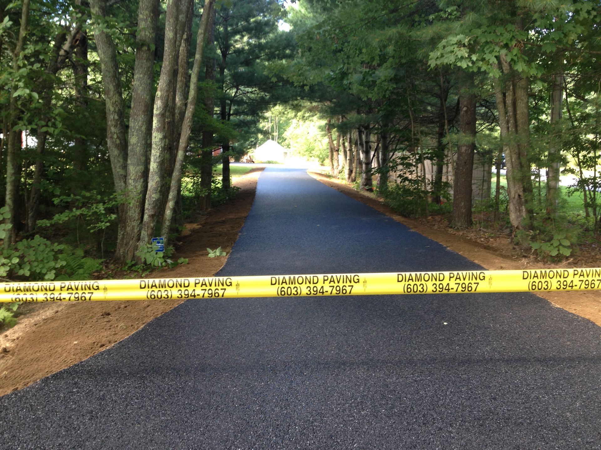 a road with a yellow caution tape on it