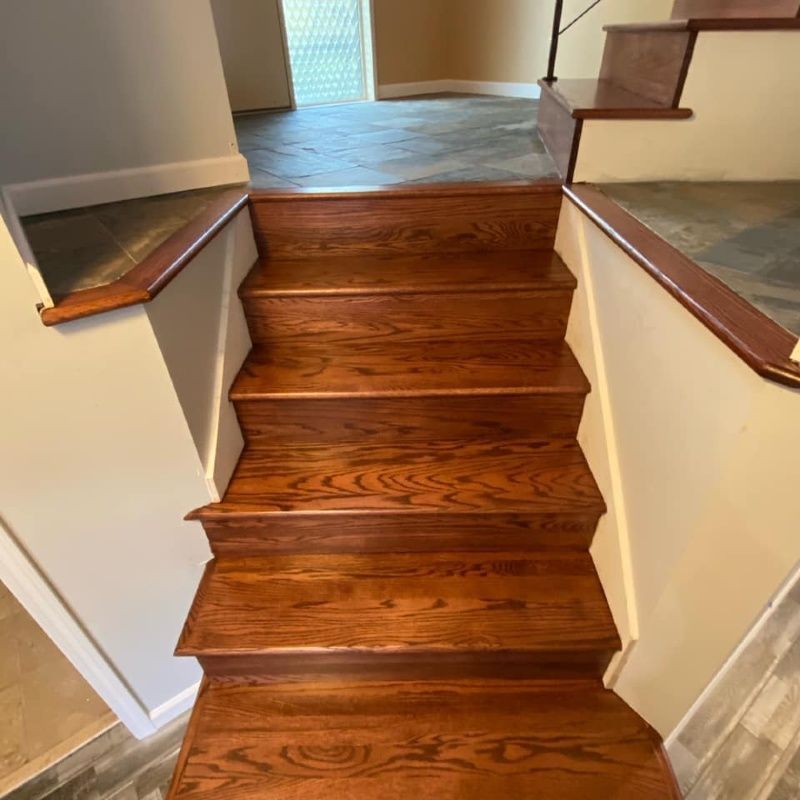 A set of wooden stairs leading up to the second floor