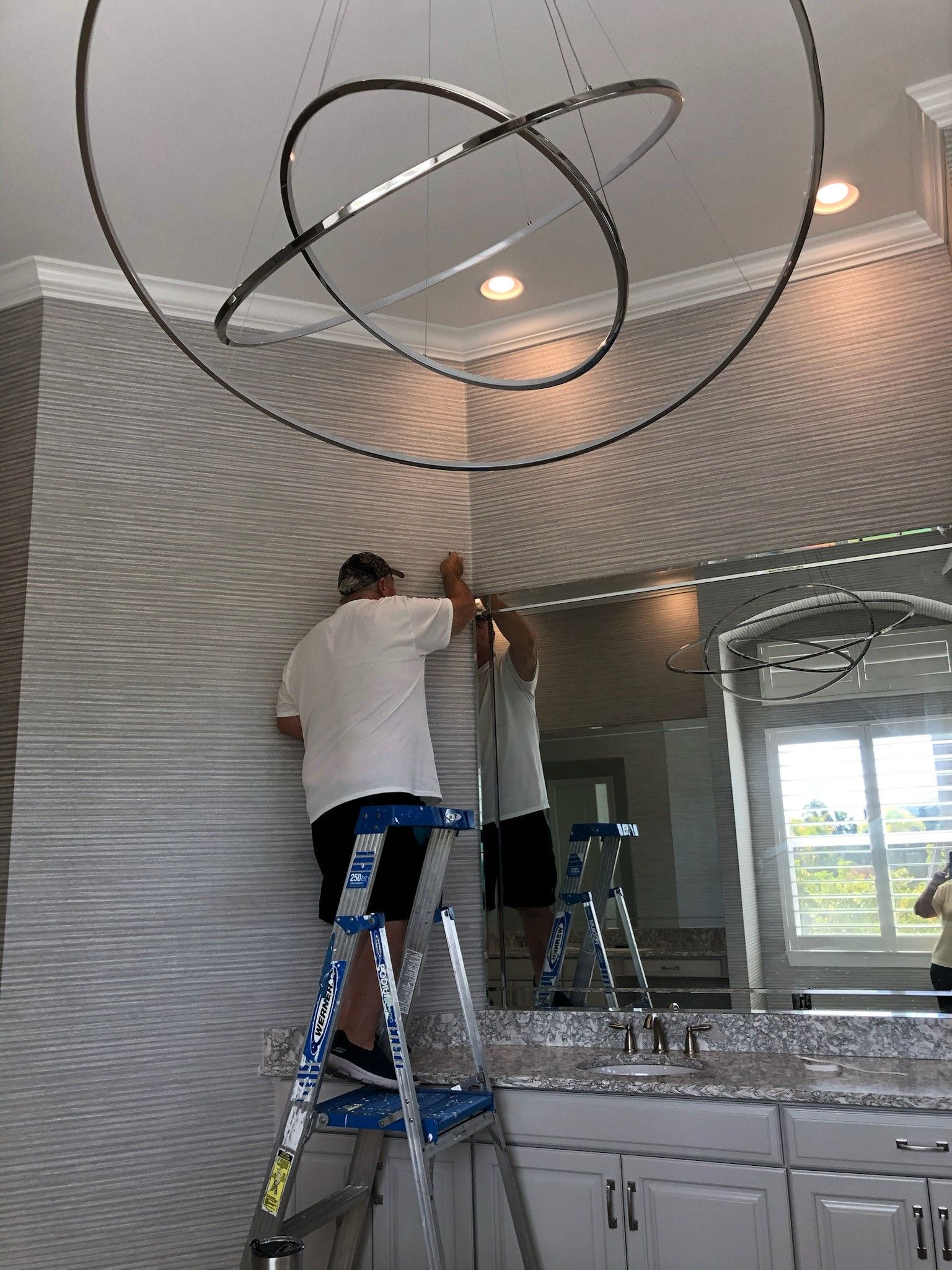 Man installing wallpaper