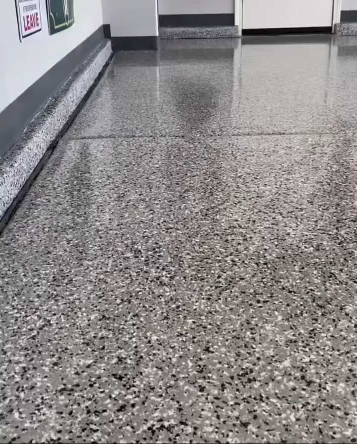 Gray speckled epoxy garage floor.