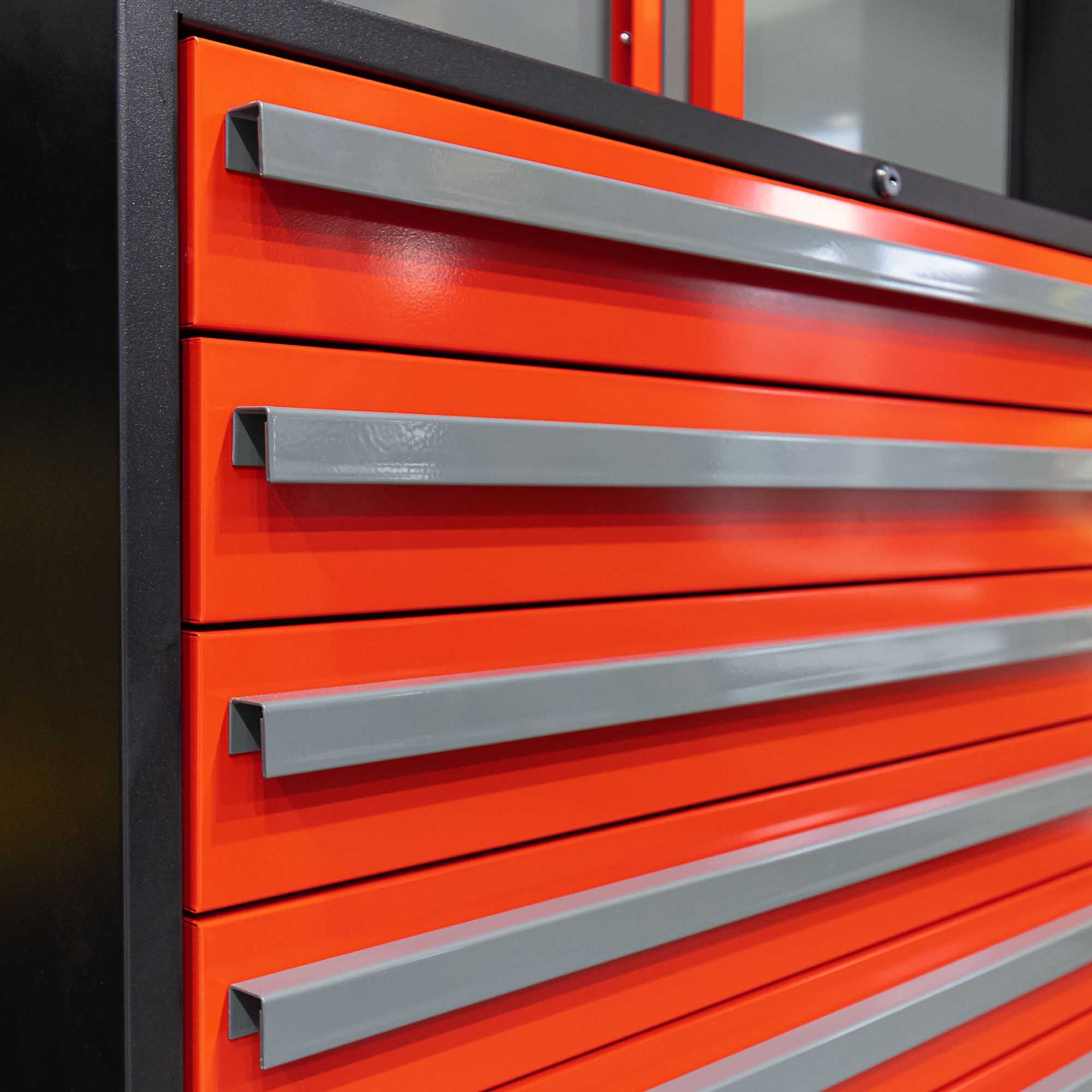 Orange tool chest with gray drawer pulls.