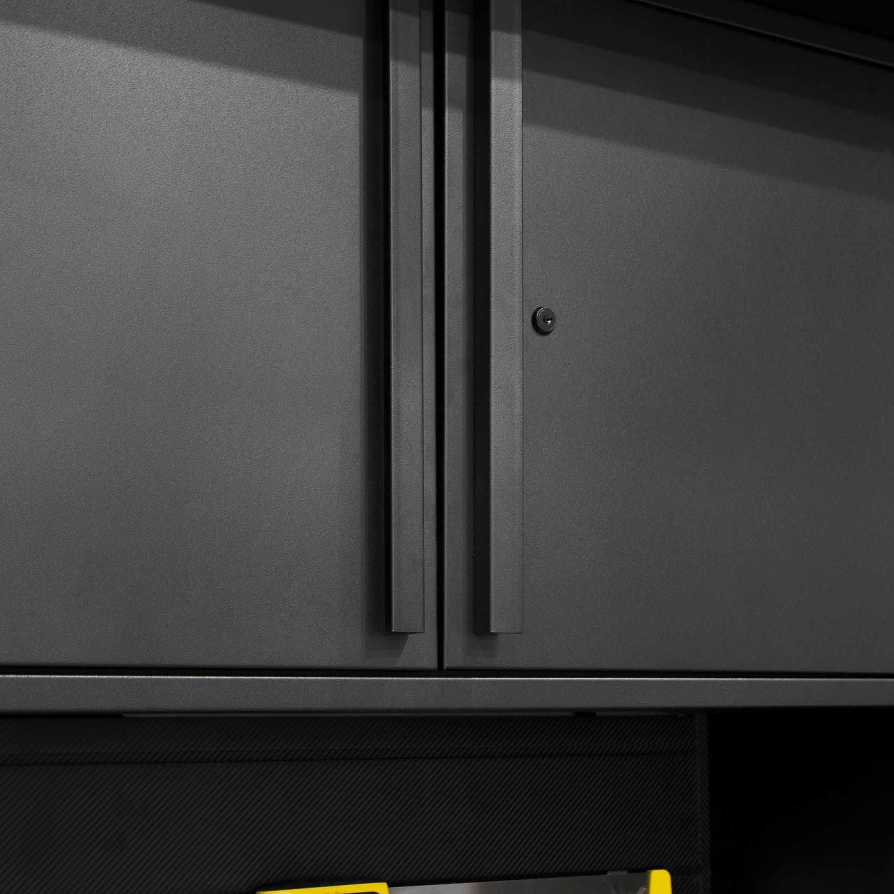 Dark gray storage cabinet with vertical handles, a lock, and textured surface.