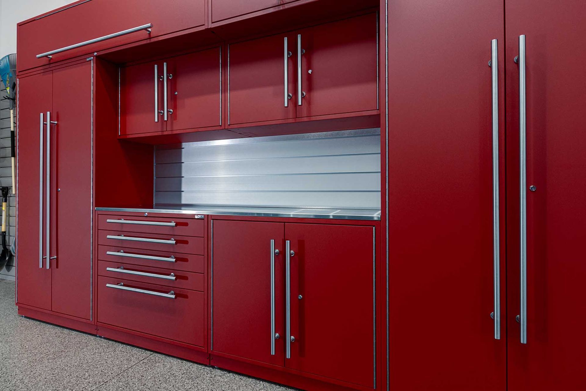 Red garage storage cabinets with silver hardware.
