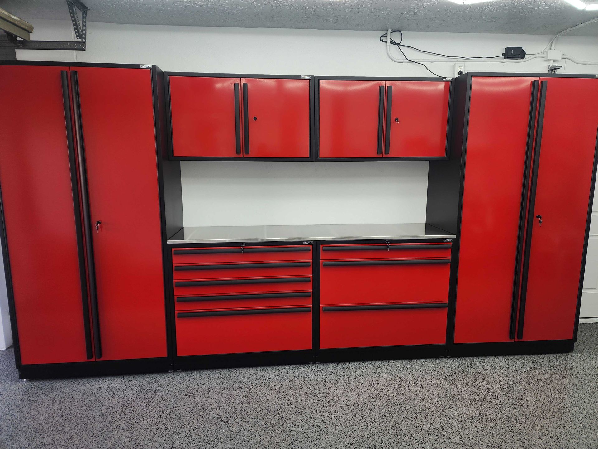 Red and black garage storage cabinets.