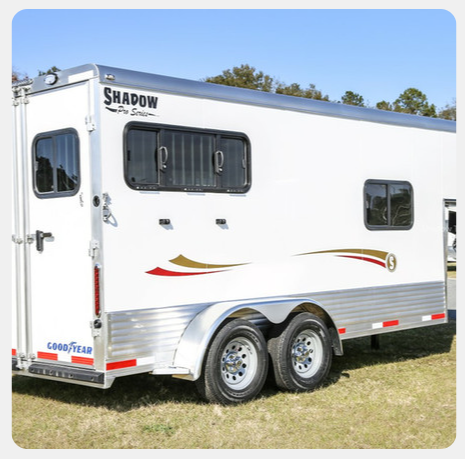 A white trailer with the word shadow on it