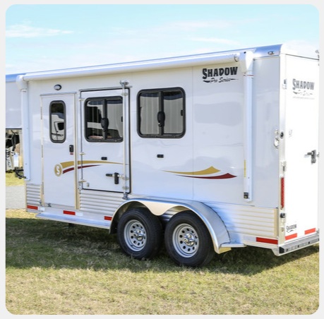 A white trailer with the word shadow on it