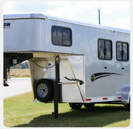 A horse trailer with the word ow on the side