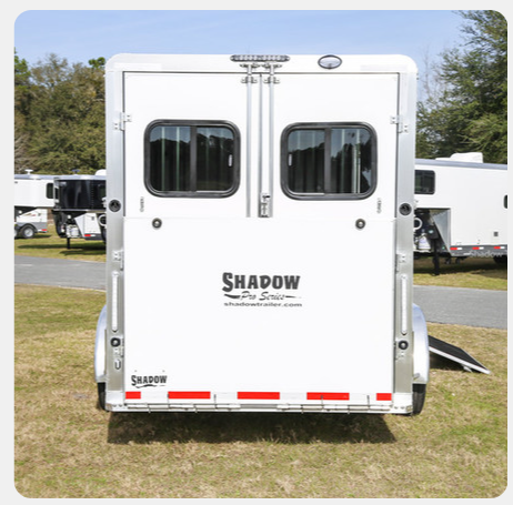 A white trailer with the word shadow on it
