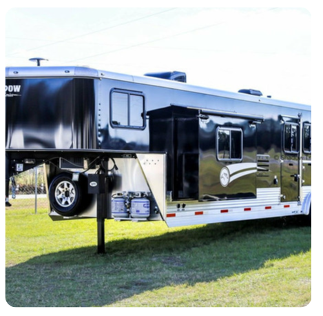 A horse trailer with the word pow on the side