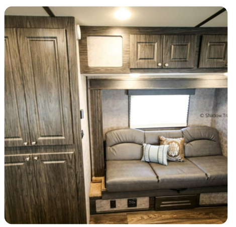 A living room with a couch and a window