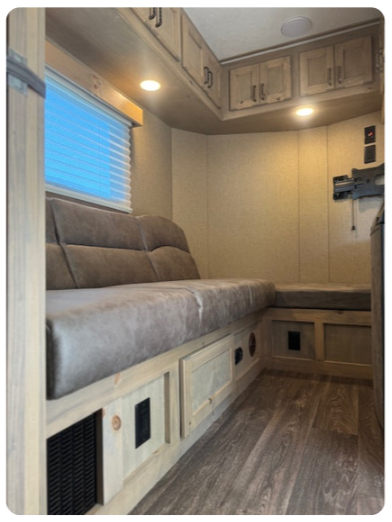 A living room with a couch and a window