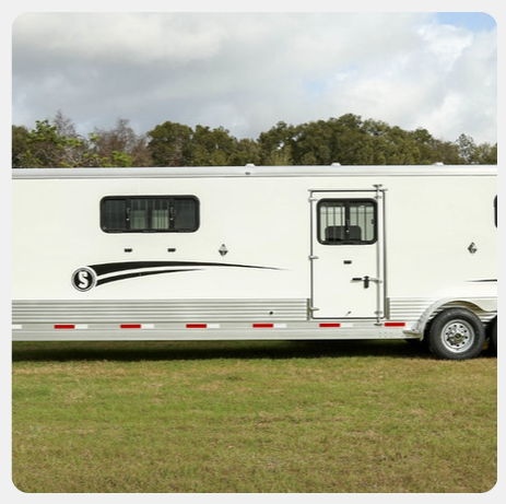 A white trailer with the letter s on the side