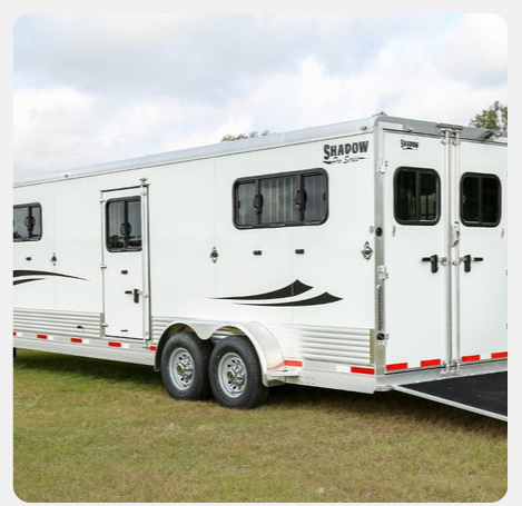 A white trailer with the word shadow on it