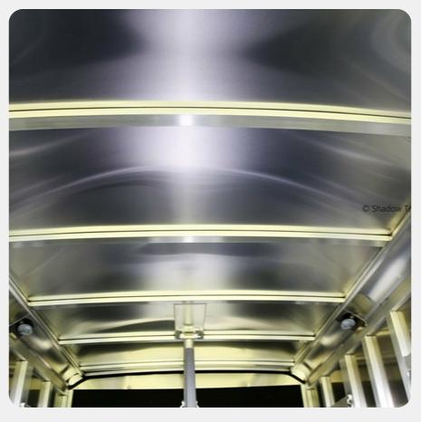 A picture of a metal ceiling with a light on it