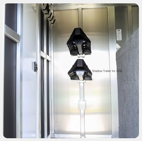 A stainless steel door with shadow horse inc. written on it